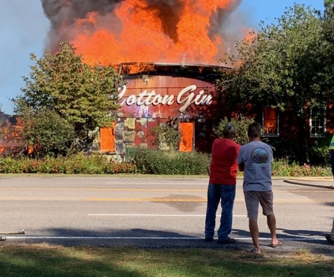 Flames engulfing the building