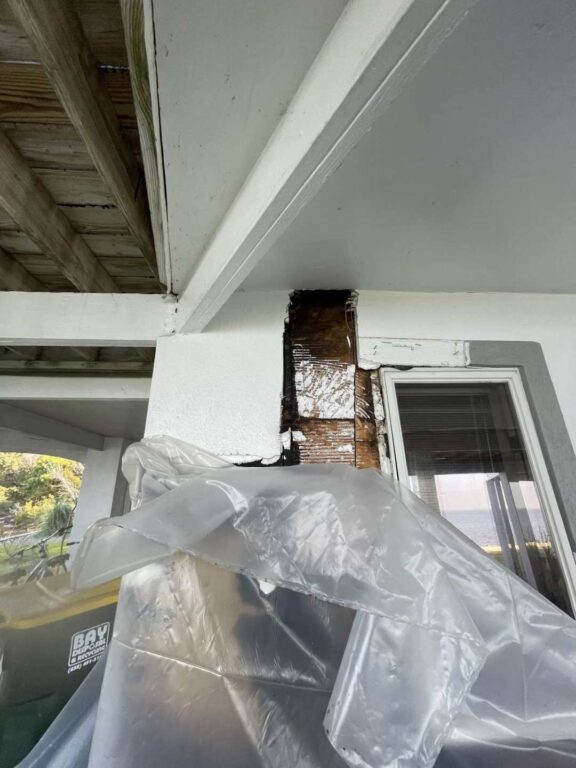 Origin of fire, electrical outlet, burned interior wall through to exterior wall