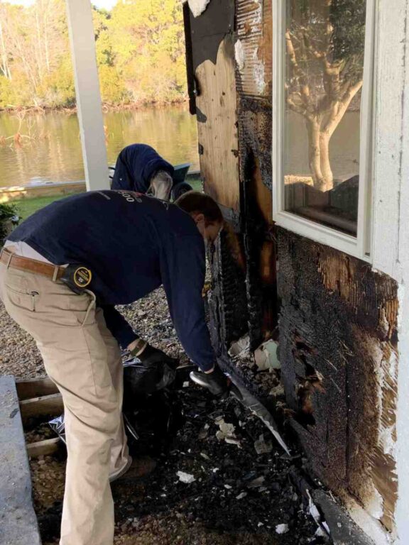 Clean up of charred building materials to begin board up of exterior wall
