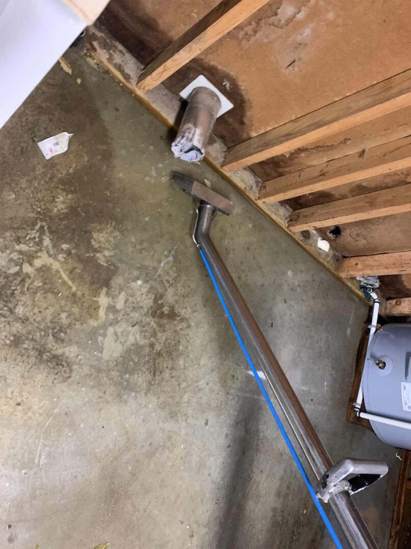 Vacuuming up wastewater, then applied disinfectant to affected area