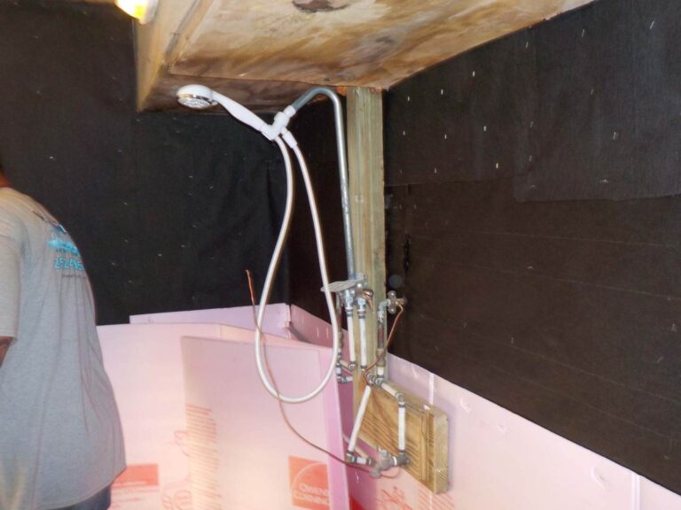 replace old plumbing fixtures in outdoor shower