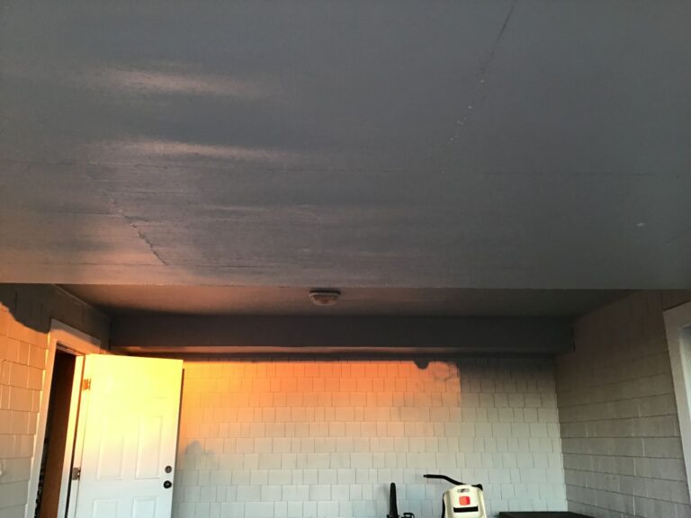 Carport underpinning bulging with flood water, BEFORE