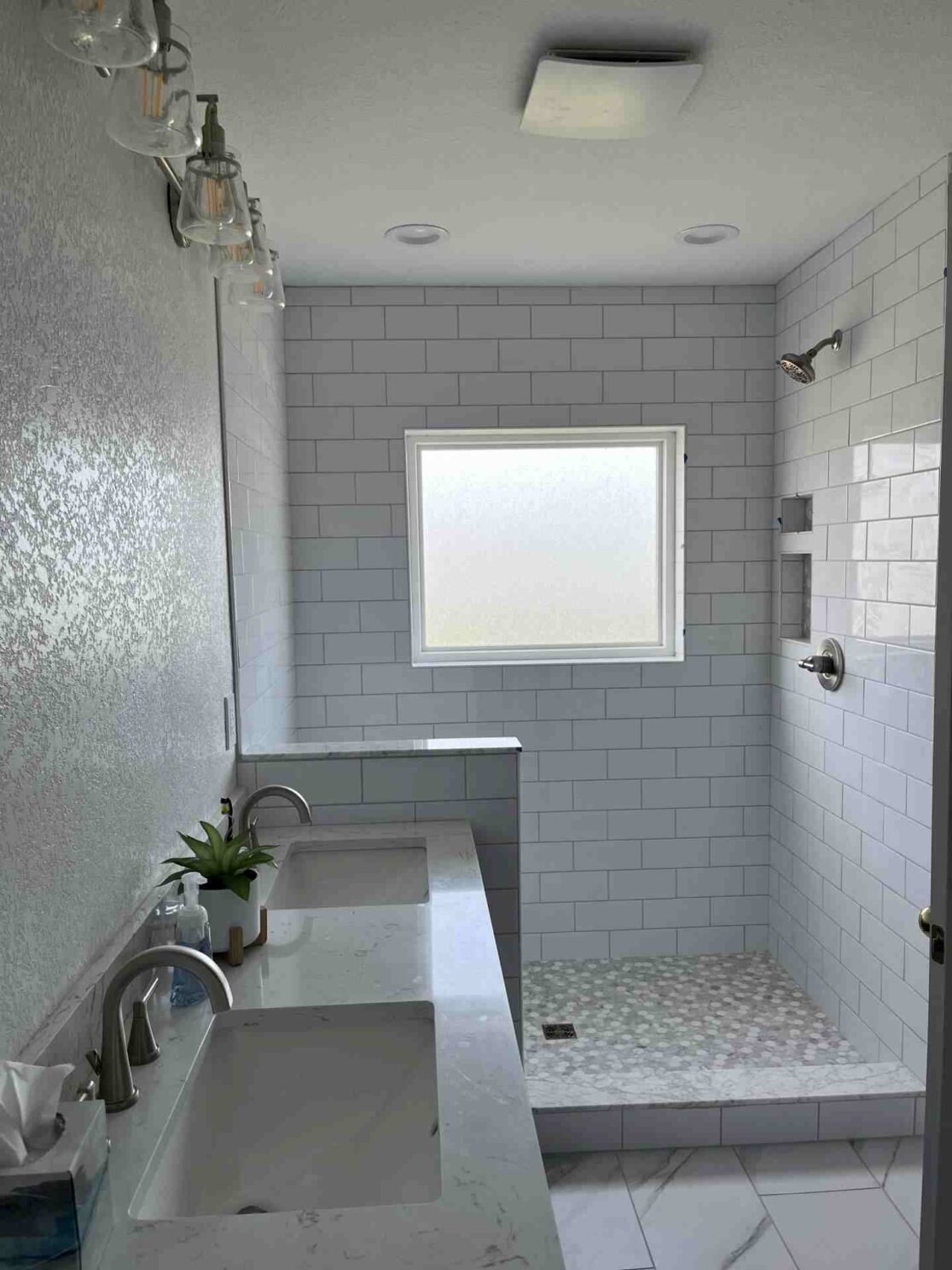 AFTER with new vanity, tile floors, and tile shower