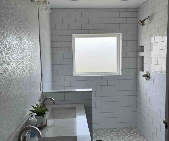 AFTER with new vanity, tile floors, and tile shower