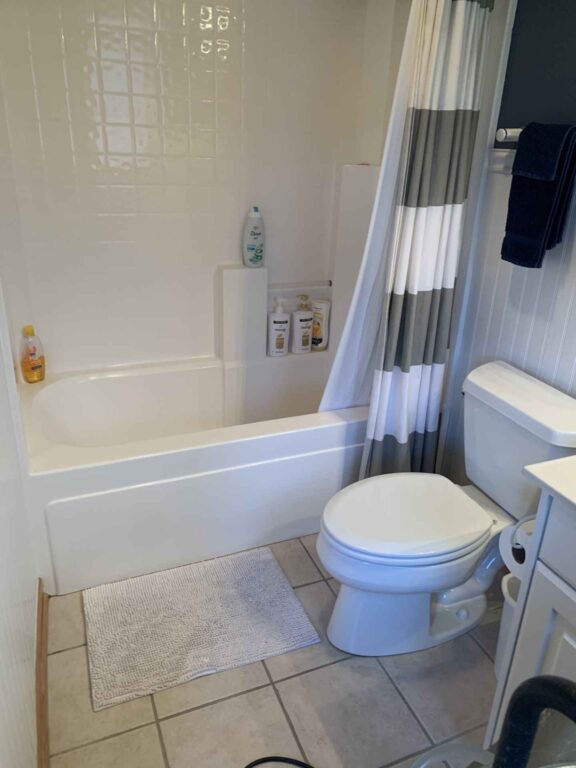BEFORE water damaged bathroom, wet floors under tile