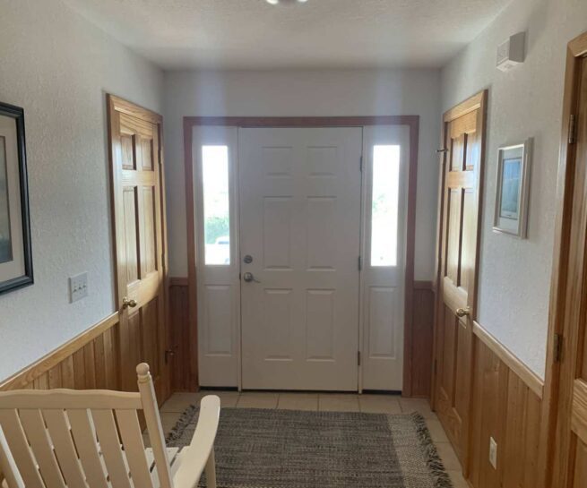 Front door foyer saturated by flooded house