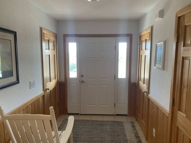 Front door foyer saturated by flooded house