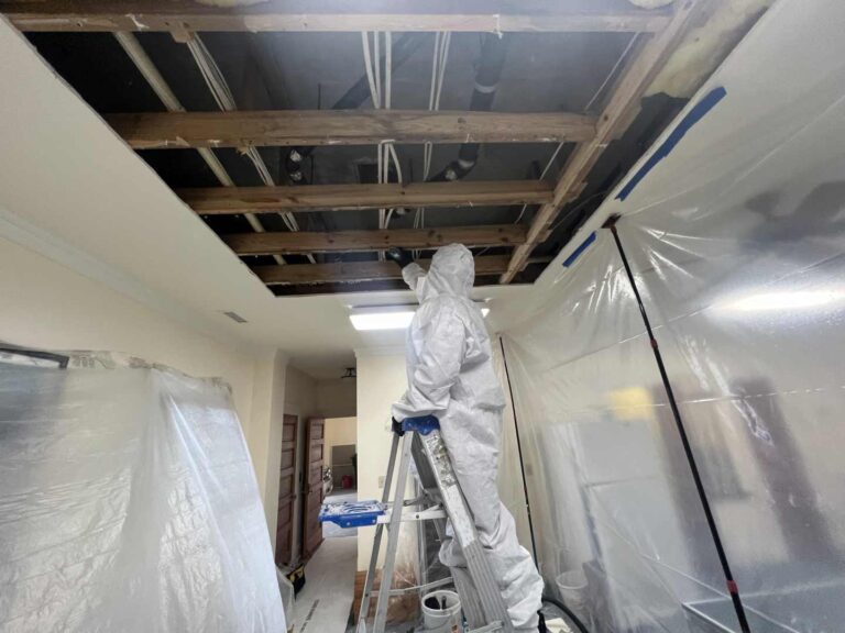 technician cleaning the framing