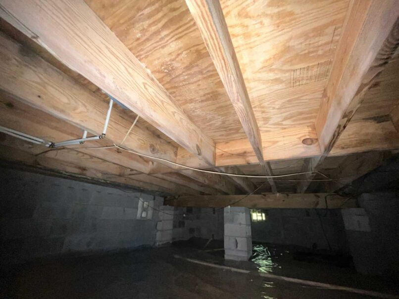 cleaned joists and vapor barrier installed