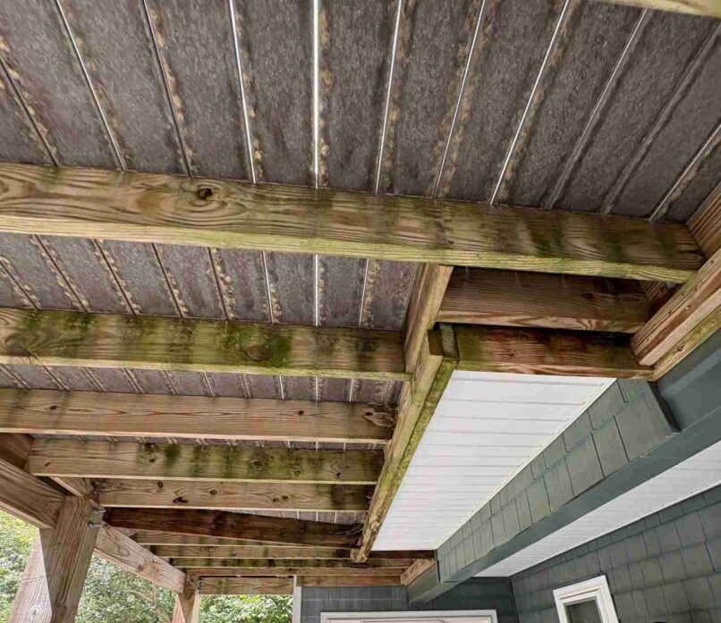 unattached deck joists, heavy water damaged